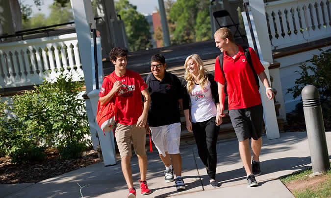 Image of 2 students walking together outside
